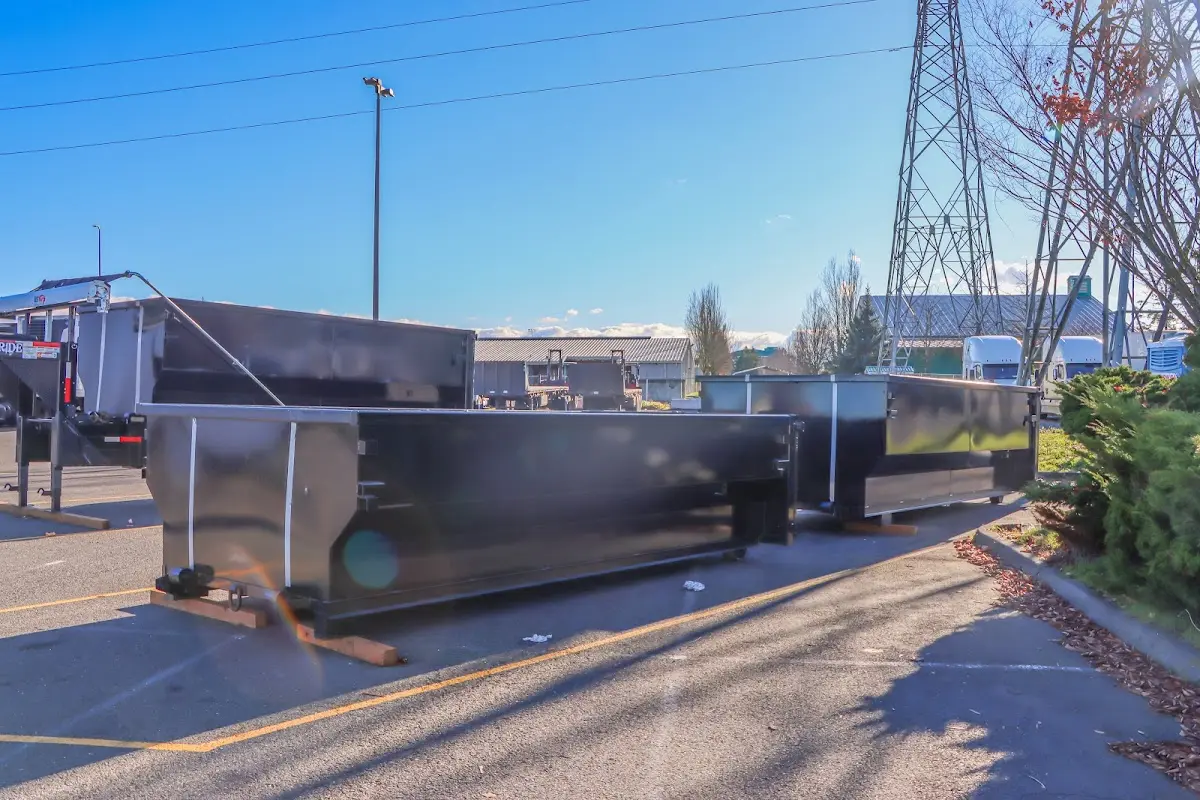 Roll-off dumpster ready for waste disposal at job site for 2 Yard Dumpster Rental in Bossier City